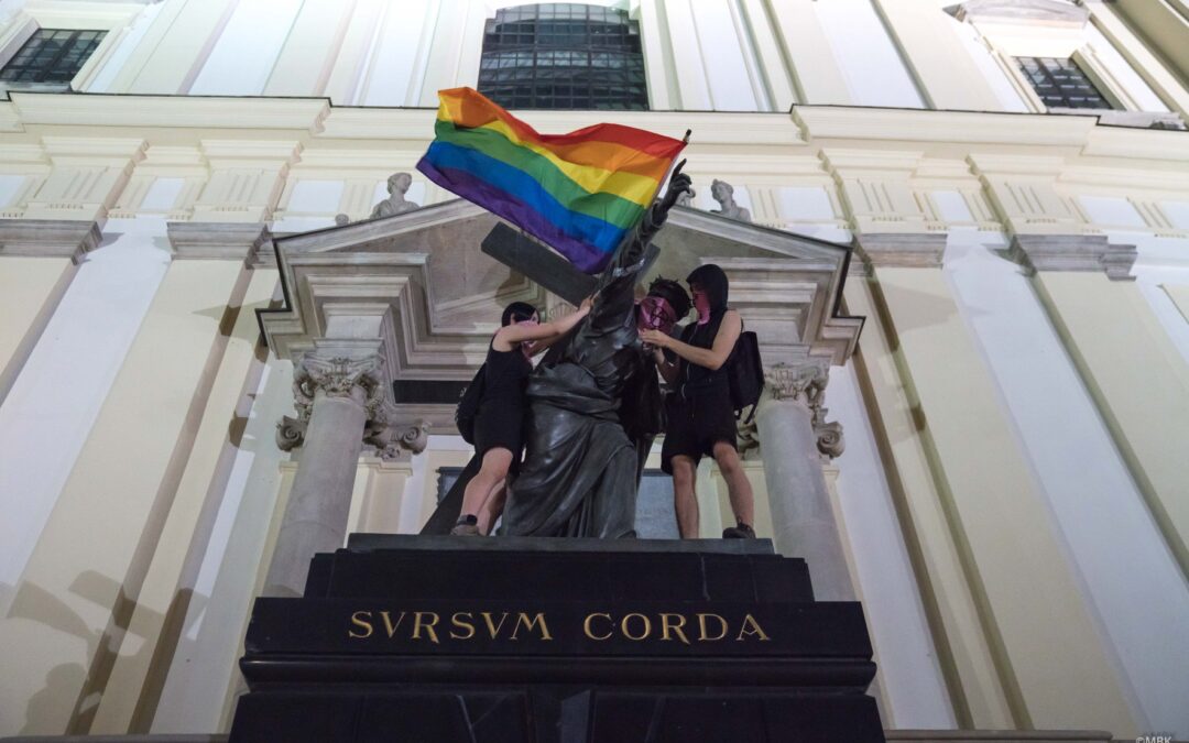 LGBT activists detained and charged in Poland for putting rainbow flags on statues