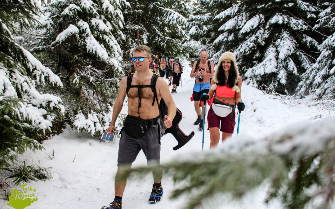 Poland’s winter swimmers take to snowy mountains for trekking in shorts