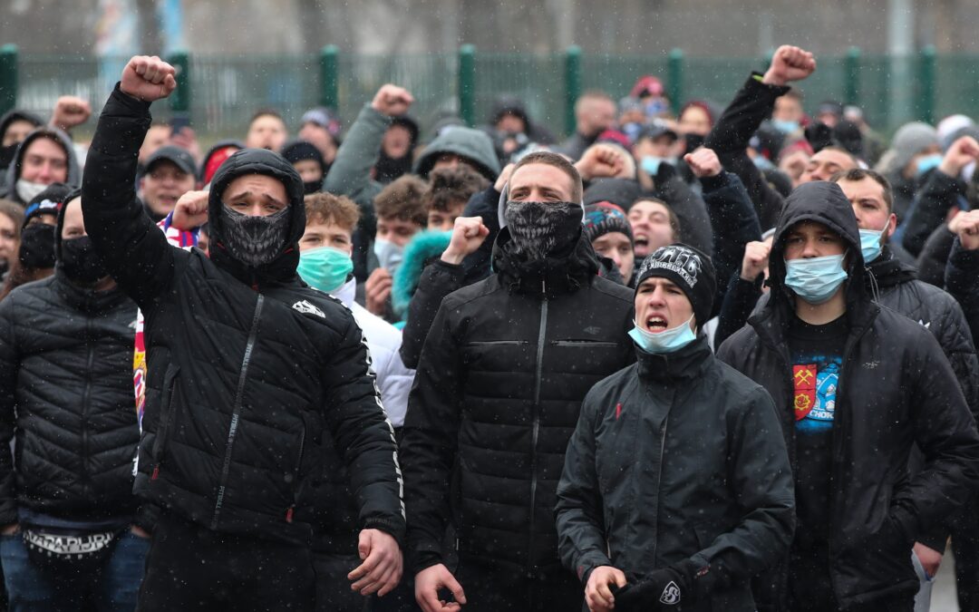 Police intervene as Polish football fans gather outside stadiums despite Covid restrictions