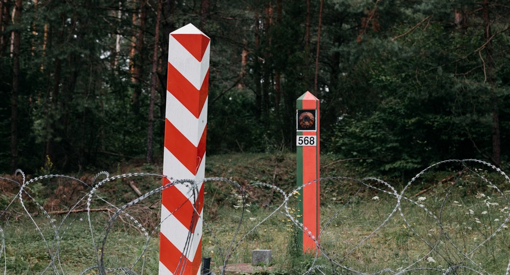 Polish woman who helped migrants at Belarus border charged with aiding their illegal entry to Germany
