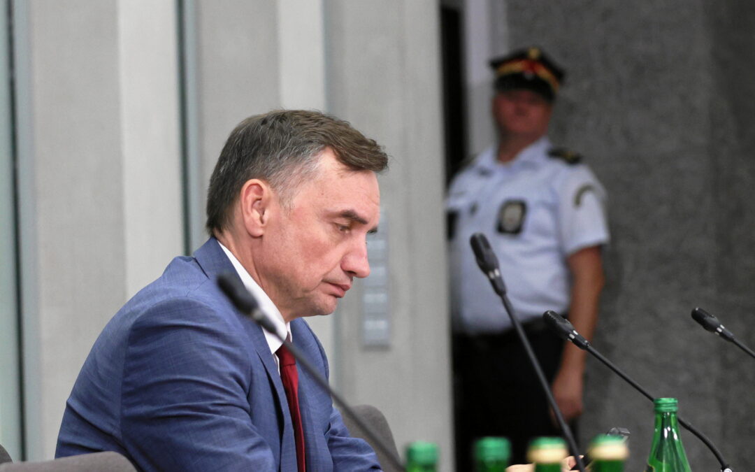 Former Polish justice minister taken by police from plane to testify before spyware investigation